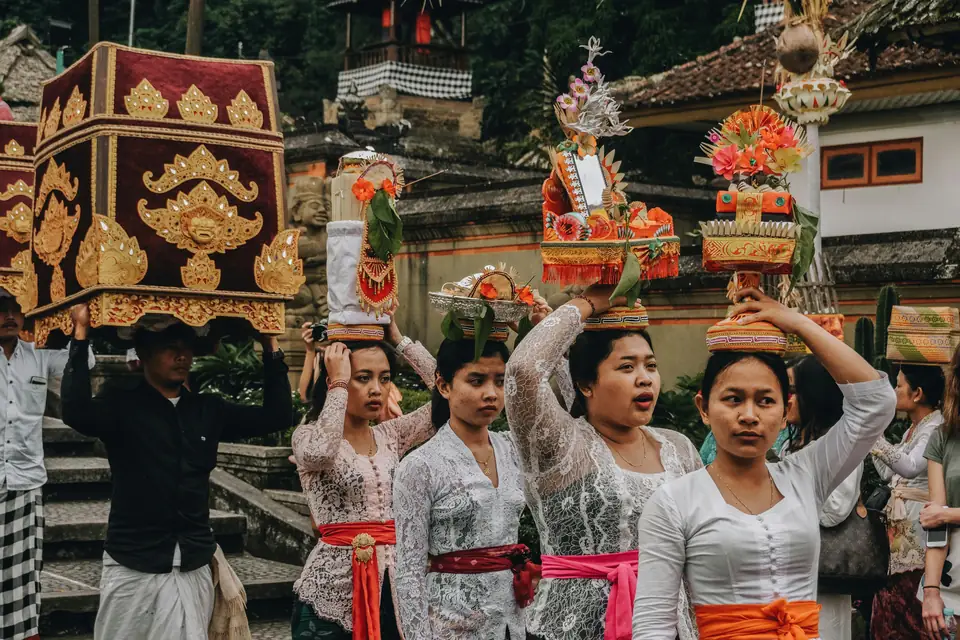 Balinese ceremony with offerings and traditional dress