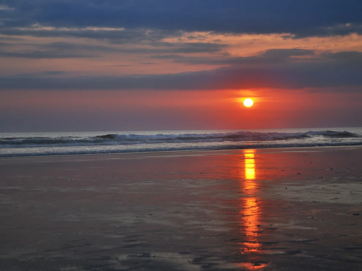 Sun setting over the sea at Seminyak Beach, Bali