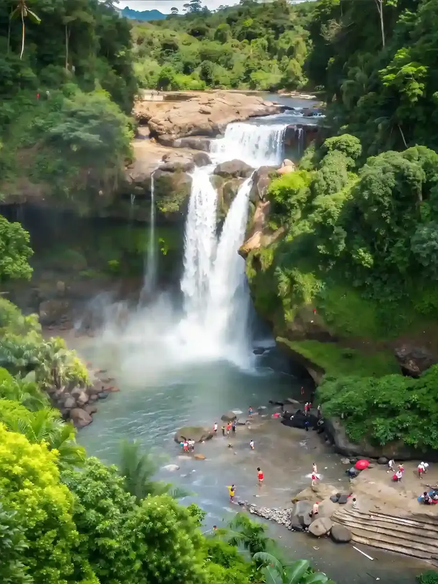 Tegenungan Waterfall surrounded by tropical forest