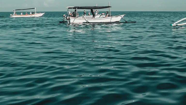 White boat on the sea under a blue sky off North Bali