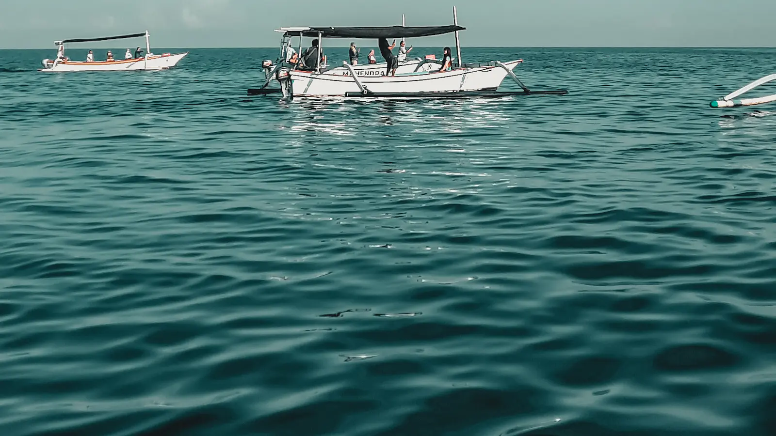 White boat on the sea under a blue sky off North Bali