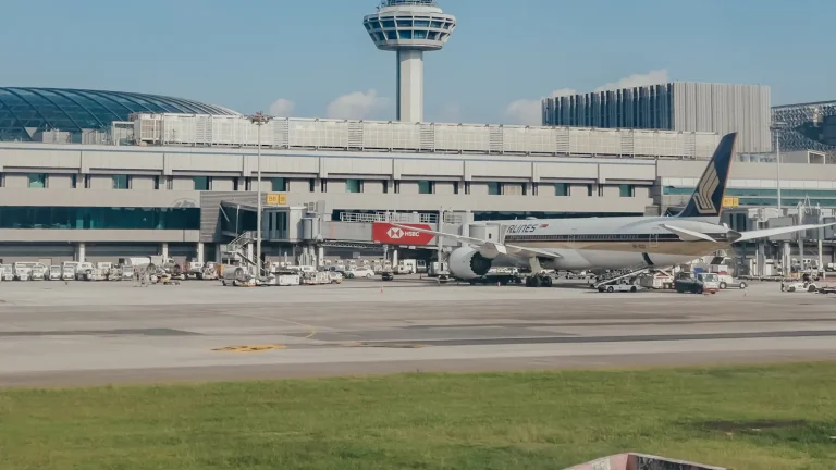Large jetliner sitting on the tarmac at an airport