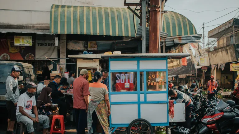 People standing near a food stall during the day
